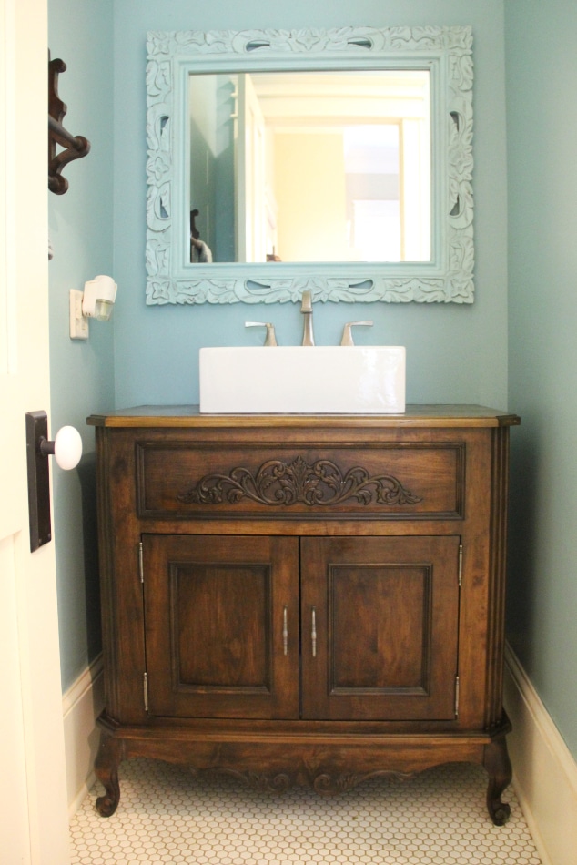 custom-vanity-cabinet-decorative-feet-vessel-sink